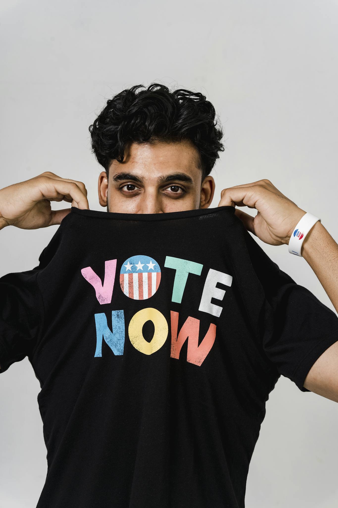 Photo Of Man Wearing Black Crew Neck Shirt With Text